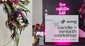 candle + wreath workshop-march 19-11:30am - craft workshop at einnim oak park - image of white pink purple and eucalyptus wreath and photo of pink neon candle bar sign on black wall in background